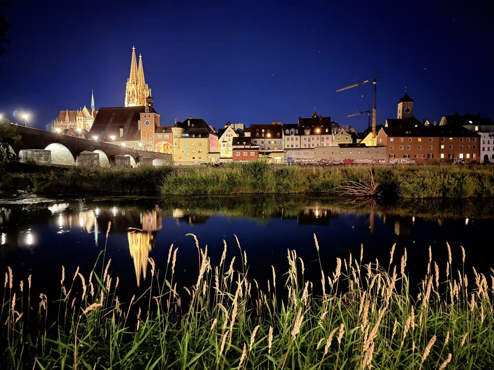 Regensburg skyline reflected in the Danube at night